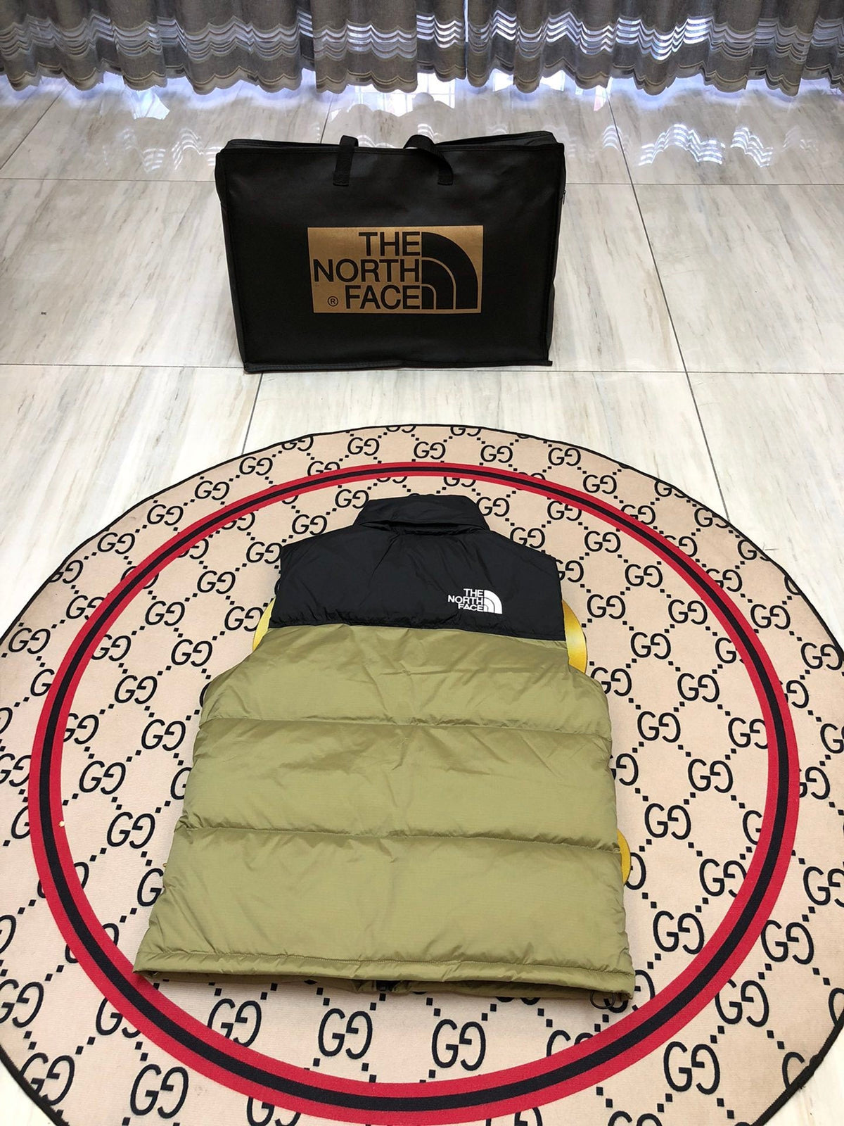 The North Face Puffer Vest in Olive Green and Black with Stand Collar